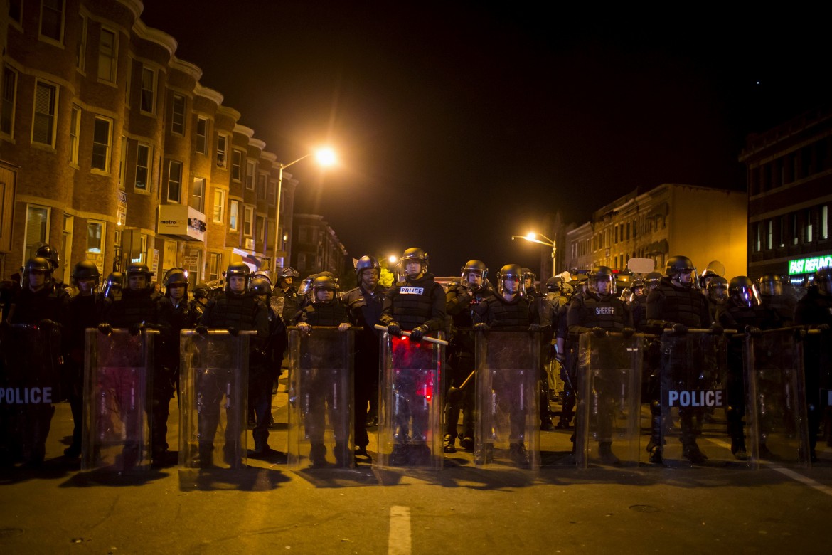 Baltimore police officials line up before implementing city-wide curfew. (Reuters)