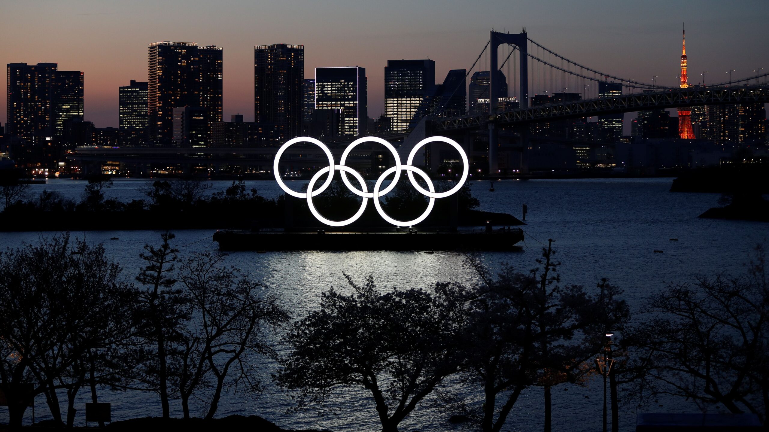The giant Olympic rings are seen in the dusk at the waterfront area at Odaiba Marine Park after postponing Games due to the outbreak of coronavirus disease (COVID 19), in Tokyo Tokyo 2020 Olympics Games