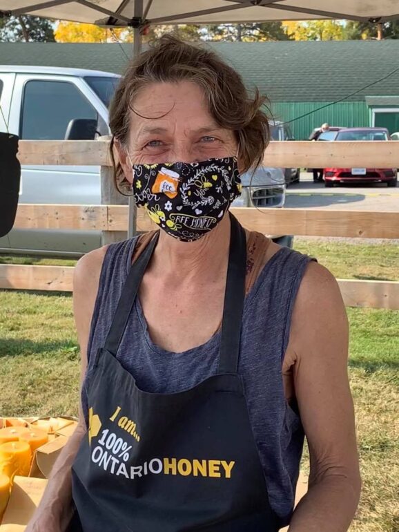 Susan Frame is all smiles behind her mask at the Milton Farmers Market.