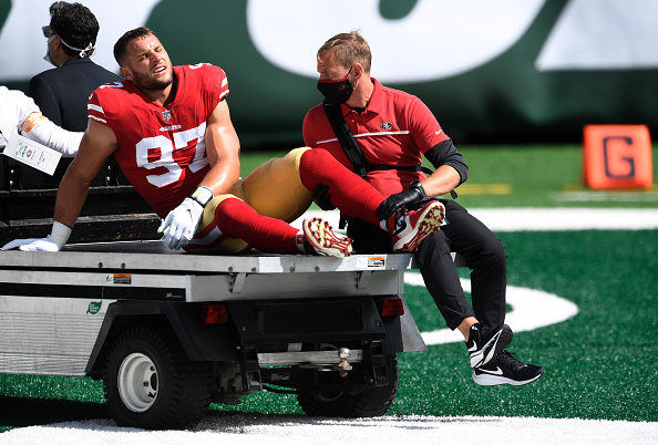 EAST RUTHERFORD, NEW JERSEY - SEPTEMBER 20: Nick Bosa #97 of the San Francisco 49ers is carted off the field after sustaining an injury during the first half against the New York Jets at MetLife Stadium on September 20, 2020 in East Rutherford, New Jersey. (Photo by Sarah Stier/Getty Images)