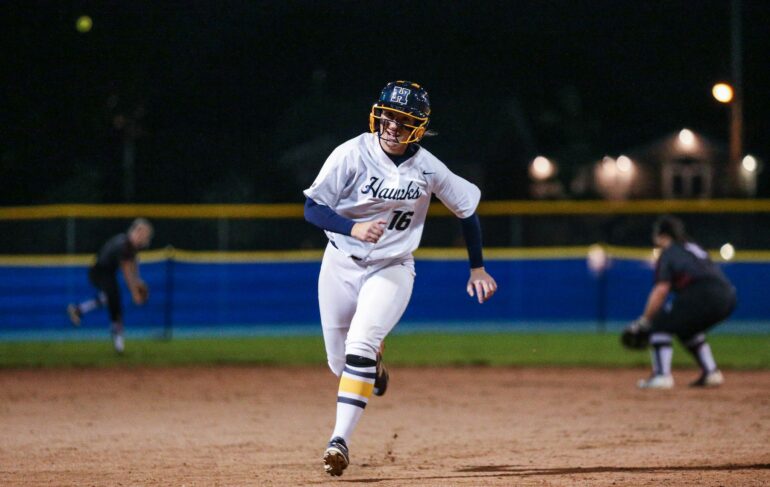Hailey Pasma rounds the bases during the first game of back to back agains Durham College, the Hawks went on to win