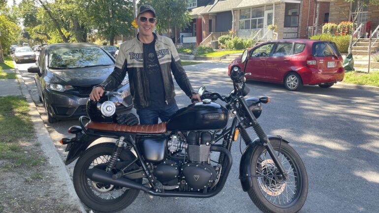 Sean Mayars, advertiser and realtor at Century21 with his cruiser motorcycle.