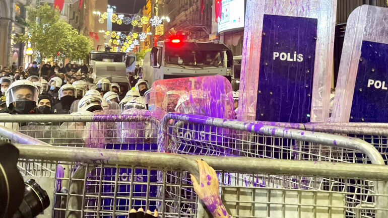 Turkish police block off demonstrators with barriers and do not let them move on streets on Nov. 25, in Istanbul, Turkey.