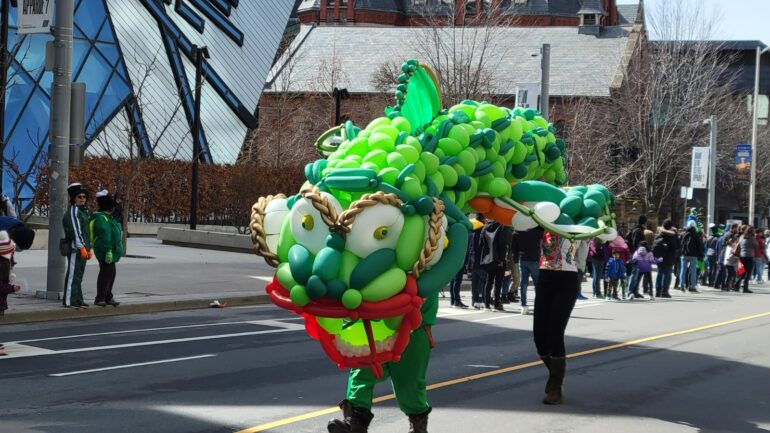 A giant green fish made of balloons on St. Patricks Parade, at Queen Street West.