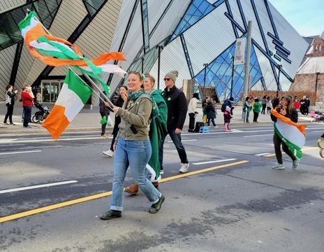 People waving the Irish flag and tricolours at the March 21 Toronto St. Patrick's Parade.