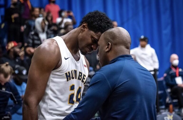 Omar Miles instructs his player forehead to forehead with intensity. Miles says the trust between he and his players is so strong that they would run through a wall for each other.