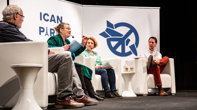 Seth Shelden (right) sitting on a panel at ICAN Paris in 2020.