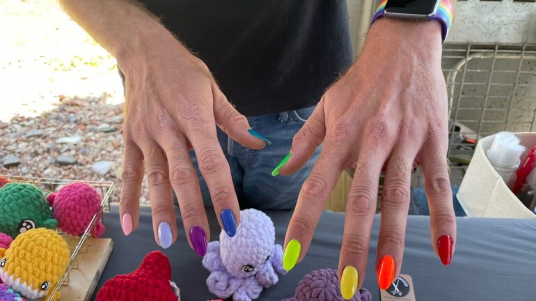 The vendor applied rainbow coloured nail polish and promoted pride month.