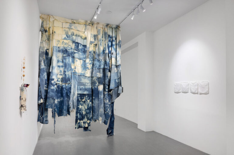 Still, unfolding exhibition featuring pieces made from denim.