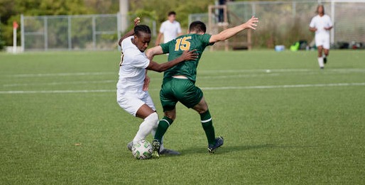 Kadell Thomas dribbles past Saints defender Fares Akhdar during the Oct. 1 match. Humber won 2-1 with a last-second goal. Thomas is currently the Hawks' top goal-scorer.