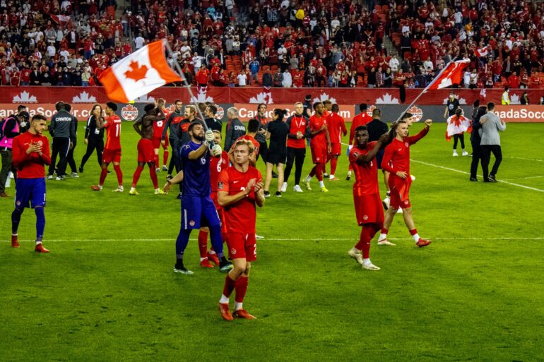 Players celebrating with fans after Canada's 4-1 win over Panama on Oct. 13, 2021