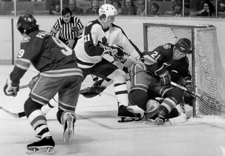 Toronto Maple Leafs' Borje Salming (21) dumps Paul Gardner of the Colorado Rockies on top of Leafs' goalie Mike Palmateer during first-period action during their National Hockey League game in Toronto on Jan. 4, 1978. The Leafs defeated the Rockies 5-0.