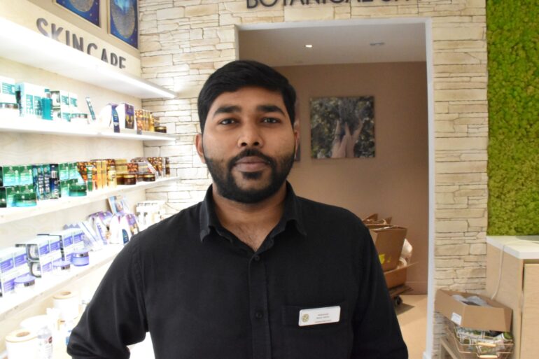 Mohammed Ismael, a store employee at YVES Rocher, a personal care store located in the Toronto Eaton Center mall.