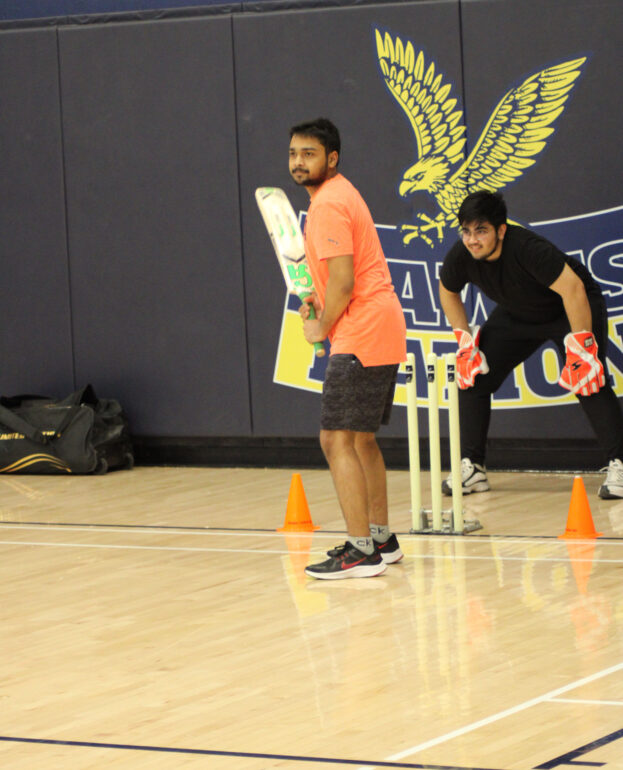 Players from the Humber North Cricket Team are practicing at Humber College's North Campus for the upcoming tournament at Conestoga College.