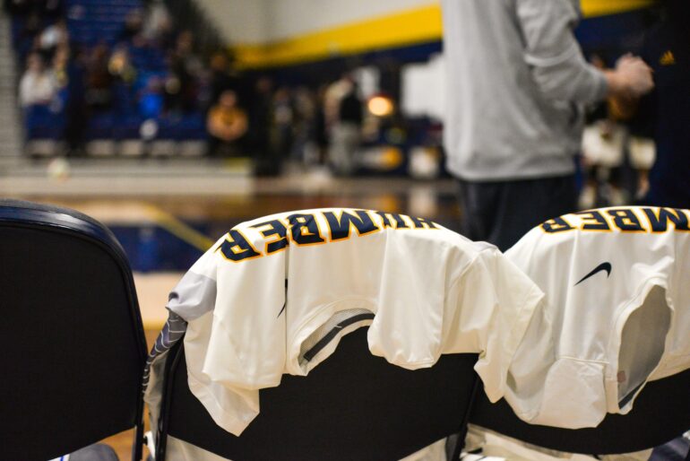 The Humber Hawks Mens' Volleyball jerseys laid on the bench before the game.