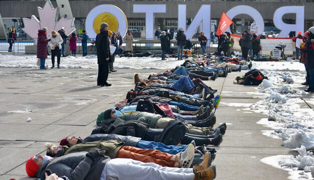 Housing advocates stage die-in, demand action for 24 hour warming centres