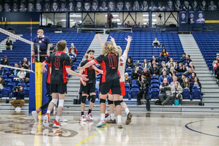 The wildcard Fanshawe Falcons celebrating a piont against the Briercrest Clippers in the CCAA championship tournament at Humber College on March 8
