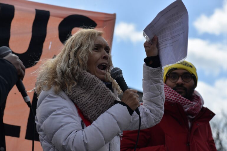 Ursula Ortiz delivered her speech on a stage during a protest.