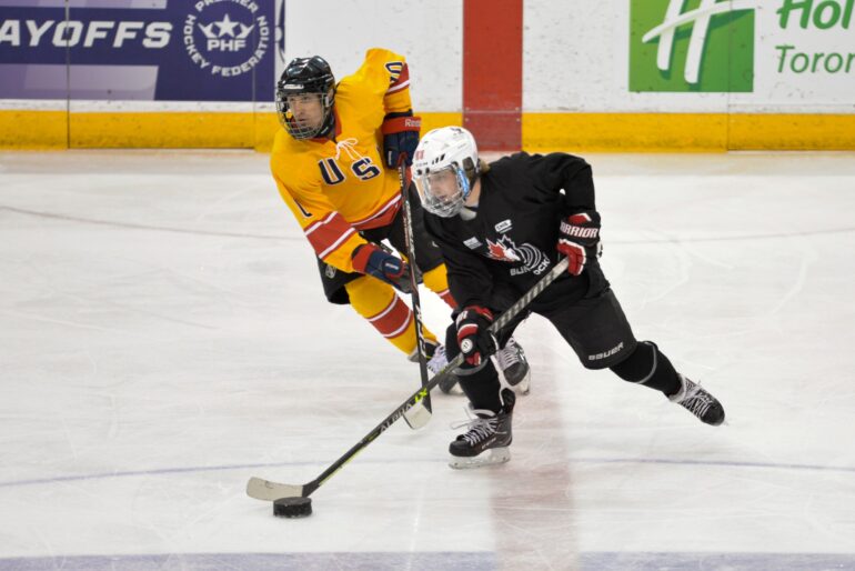 Team Canada hockey player Joe Fornasier (right) hunted down the puck from Team USA Charlie Mitchell in the 2023 Canadian National Blind Hockey Tournament in Mattamy Athletic Centre.