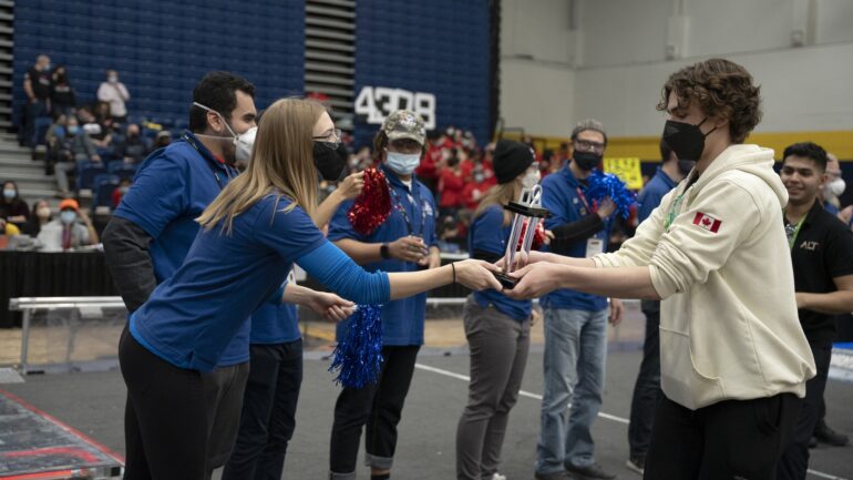 ALT-F4 North York robotics team collect their first place trophy at the annual Humber College FIRST robotics competition.