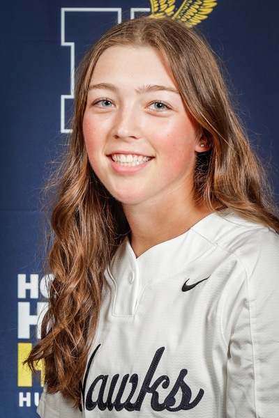 Shea Hilpert smiles for her headshot. Hilpert is a major hustler, managing two stolen bases in a match on three separate occasions.