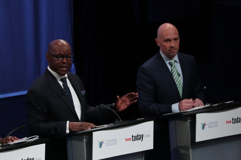 On the left, Toronto mayoral candidate Mark Saunders speaks in the debate held at the Isabel Bader Theatre in Toronto on May 25, 2023.