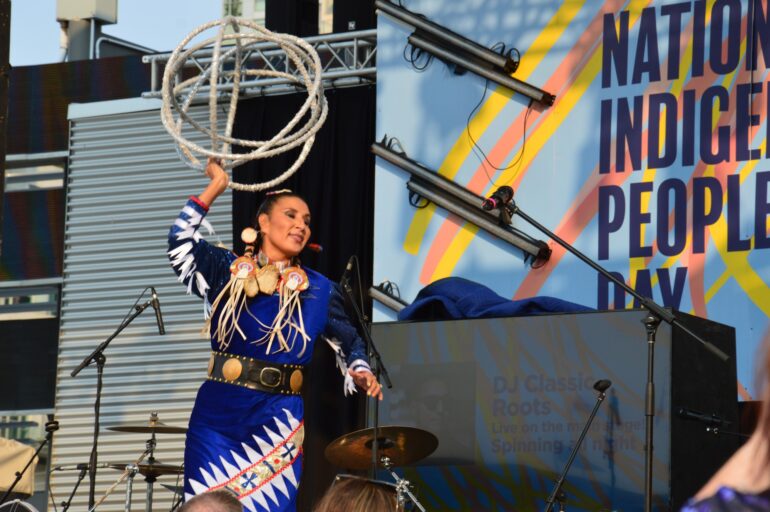Lisa Odjig, World Champion Hoop Dancer, on stage at Celebration Square.