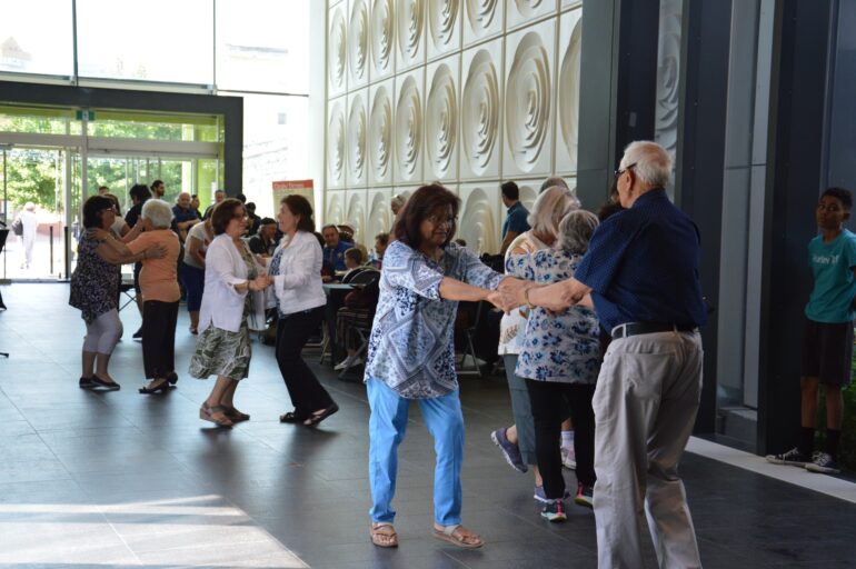 Attendees at Brampton City Hall dancing at the Italian Heritage Month celebration.