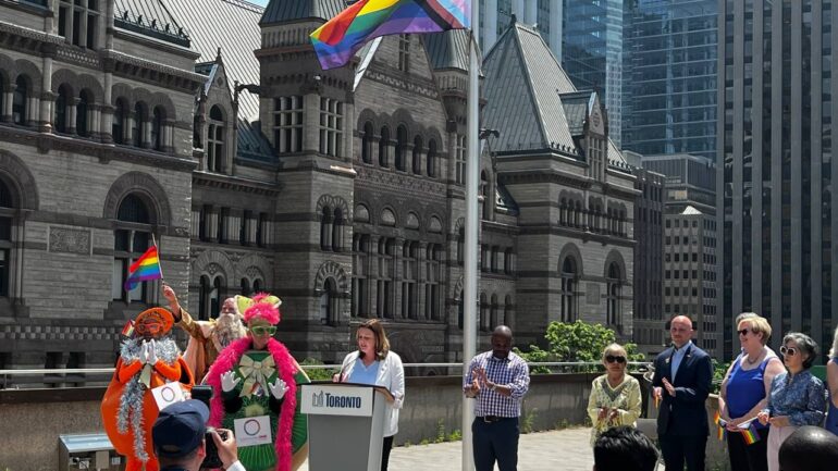 Progress Pride flag raising ceremony celebrated the beginning of Pride Month in Toronto.
Deputy Mayor Jennifer McKelvie, Members of the Council and representatives from Pride Toronto raised the Progress Pride flag at the City Hall, podium roof. June 1, 2023.