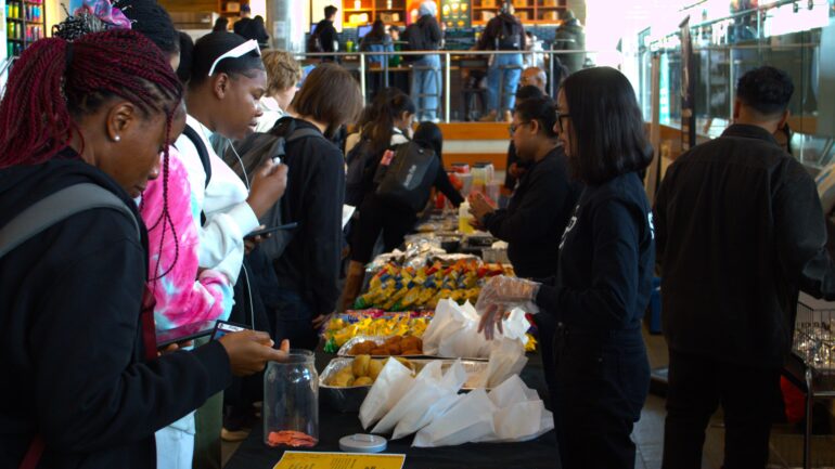 Humber students getting some food and drinks from different Afro-Caribbean regions at the Black Excellence Showcase.