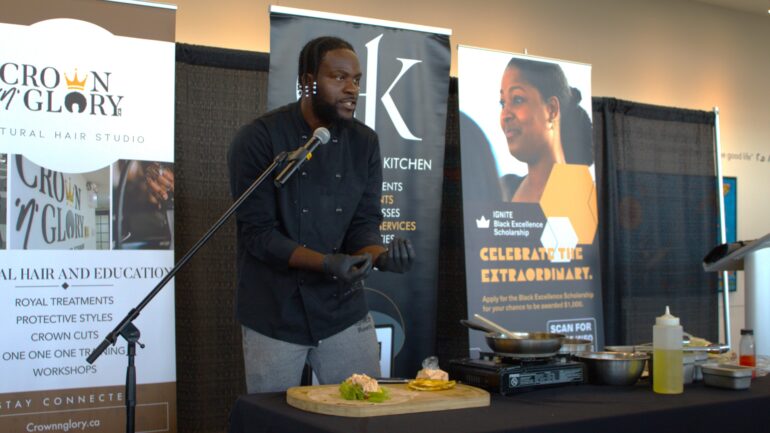 Chef Hassan Adenola demonstrates how to make a quick egg omelette on stage at the Black Excellence Showcase