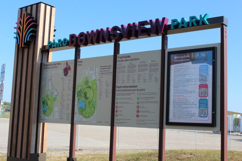 An information board of Parc Downsview Park - the information includes an overview of the the map and a trail guide information.