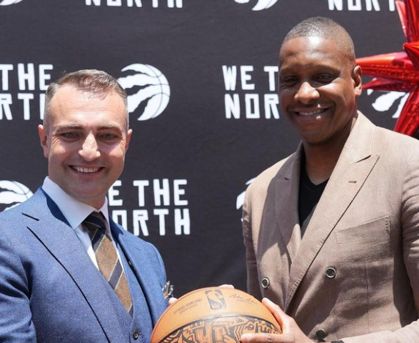 On the left, Darko Rajakovic, the new Raptors coach. On the right, Masai Ujiri, the president of the franchise.