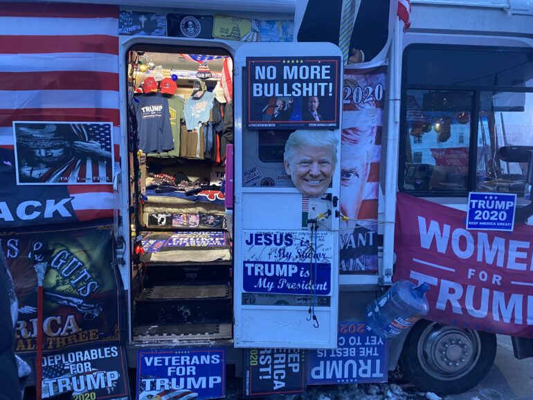 A track selling Trump merchandising in the surroundings of the SNHU Arena of Manchester, N.H., where the American politician hold a rally on Jan. 20.