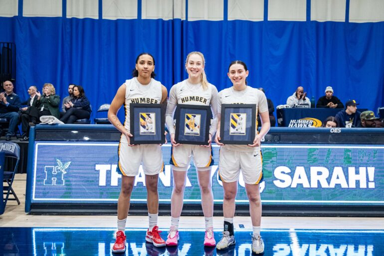 Humber Hawks seniors grom left to the right ,Teija Wareham,Katherine Khorovets,and Sarah Baptie holding their framed picture on the Feb 7 on seniors night at humber.