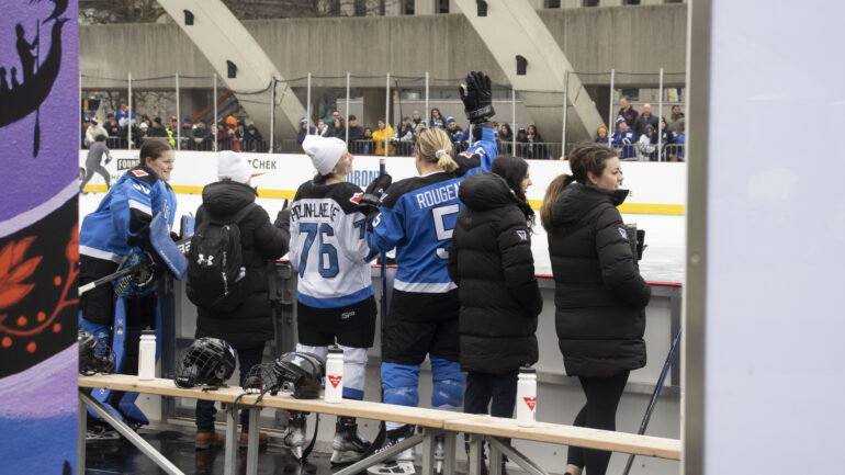 Maude Poulin-Labelle, Lauriane Rougeau, and Kristen Campbell waiving to fans who attended the skills competition.