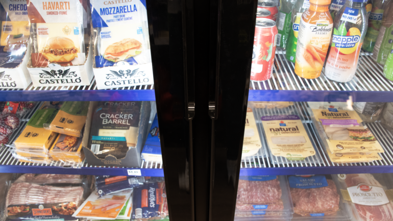 A range of cheeses, meats, and juices for sale are on display in a fridge at Gateway Market on Walmer Road on April 16.