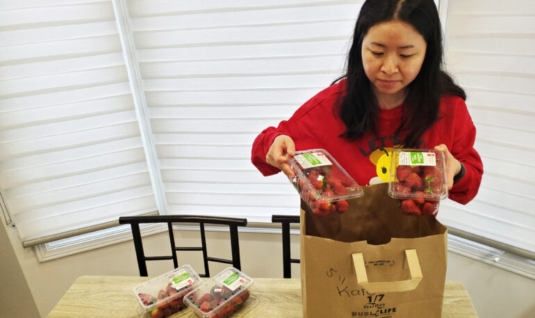 Karen Mak unpacks her haul from Flashfood app in her Markham home on April 11.