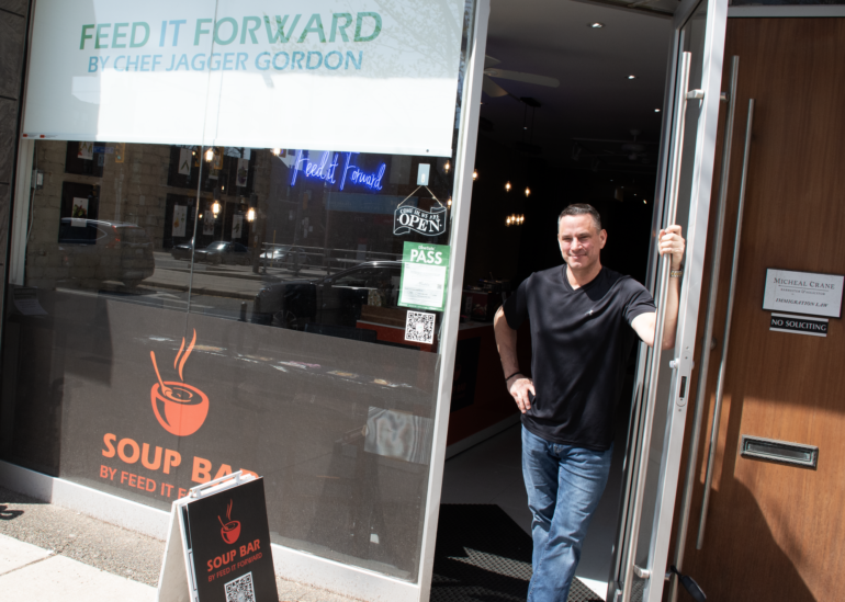 Chef Jagger Gordon, owner of the Soup Bar by Feed It Forward, welcomes customers to his store in Hillcrest Village on April 16.