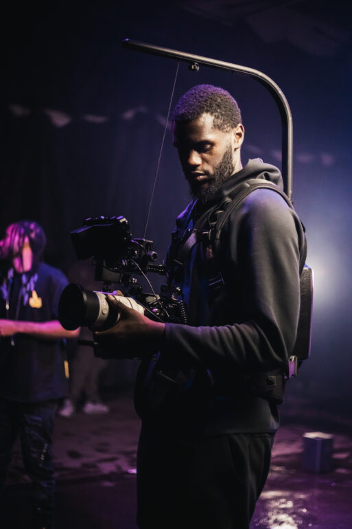 Photo of Jamani Barrett filming for a project.
