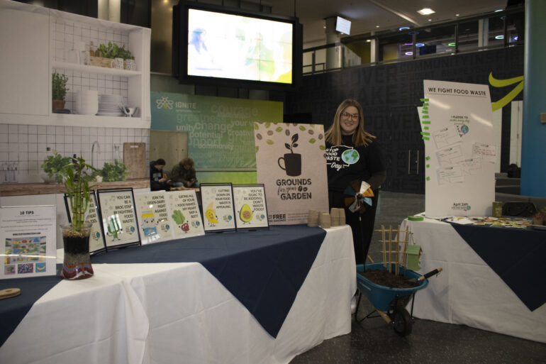Alessa Crispo from Humber's Student Life and Campus Experience, stands near the event set up.