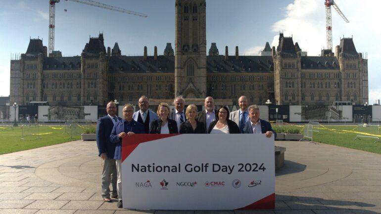 Ten members of the National Allied Golf Association (NAGA) standing on Parliament Hill on Thursday, May 23 holding a 'National Golf Day 2024' poster.